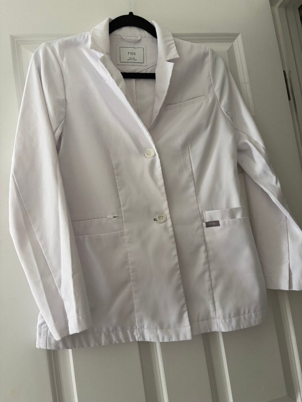White Figs coat size xs.